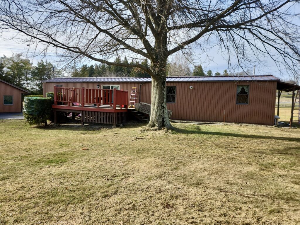 Mobile home with standing seam roof