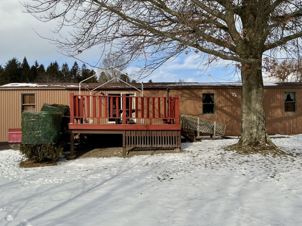 Mobile home with shingle roof